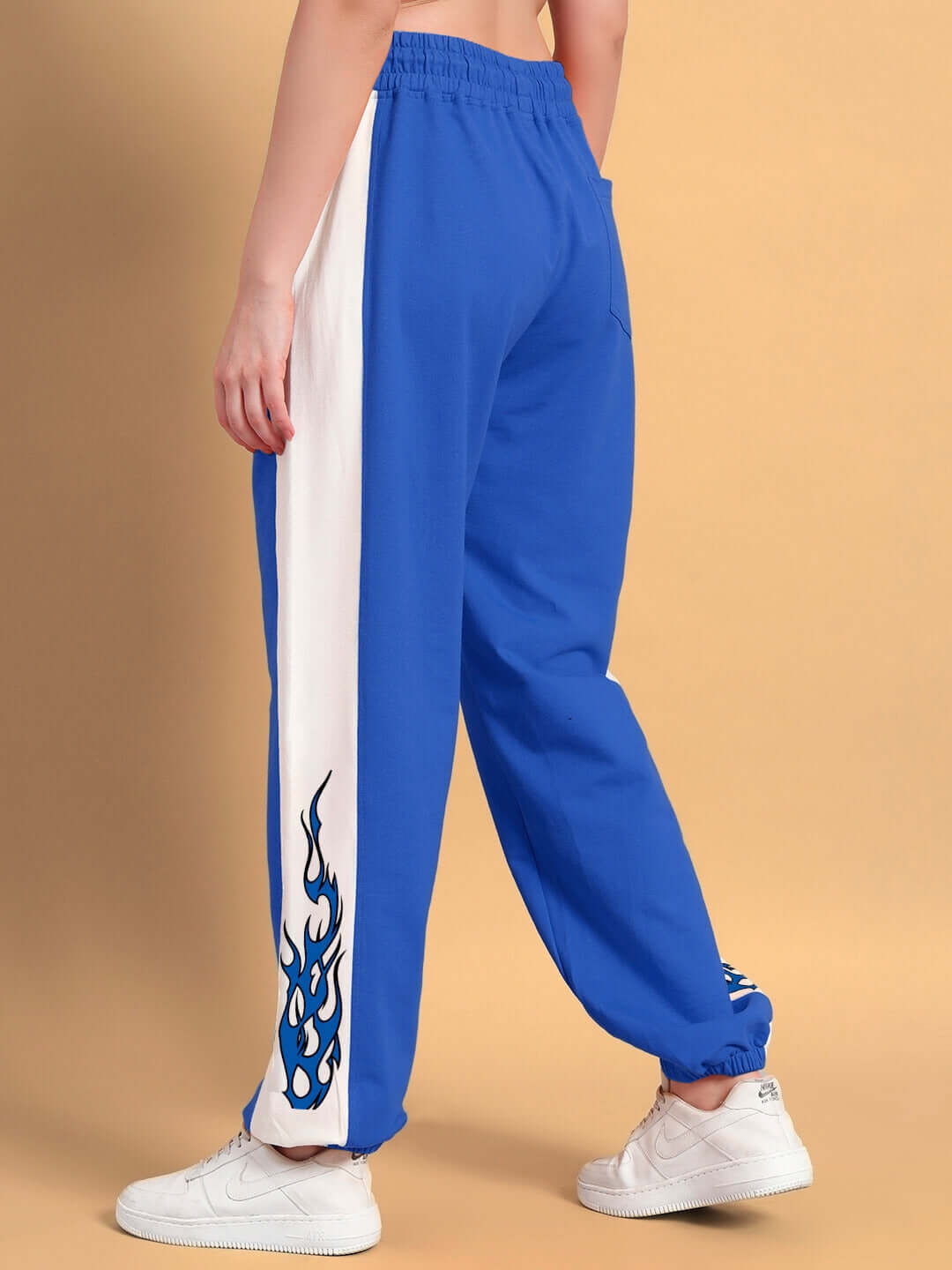 WOMENS BRACER RELAXED FIT JOGGERS BLUE-WHITE featuring a flame design on legs, providing comfort and style for casual wear.
