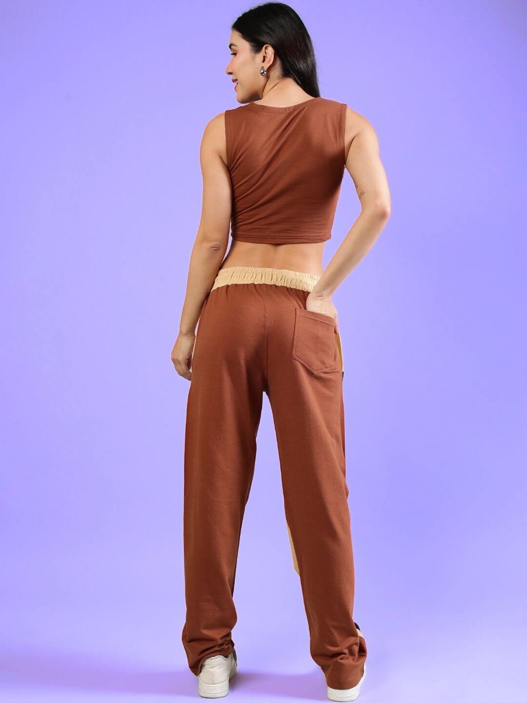 Back view of woman wearing Women's Bracing Co-Ord Set in cream brown with sleeveless top and pants, stylish casual wear.