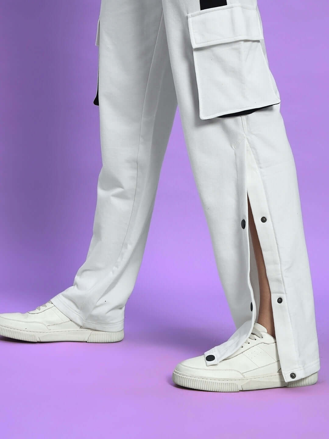 Women's Bracket Cargo Pant White Black Highlighter with neon accents and functional design, side view with utility pockets and sneakers.