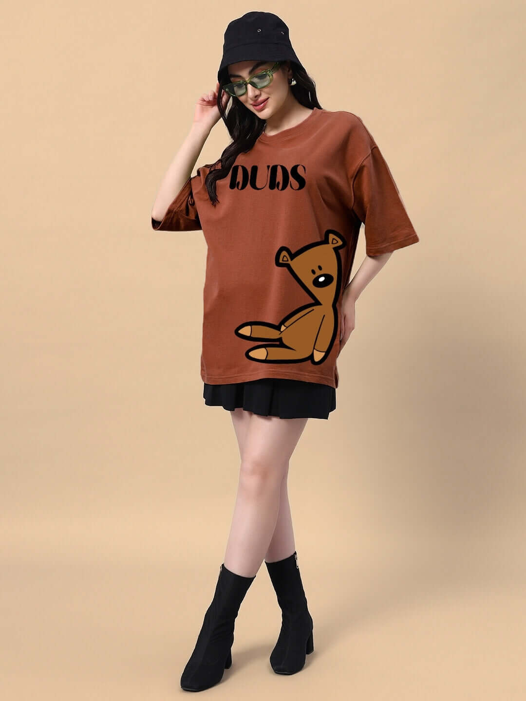 Model wearing Women's Teddy Bean T-Shirt in brown, featuring a teddy bear graphic, made from premium cotton blend fabric.