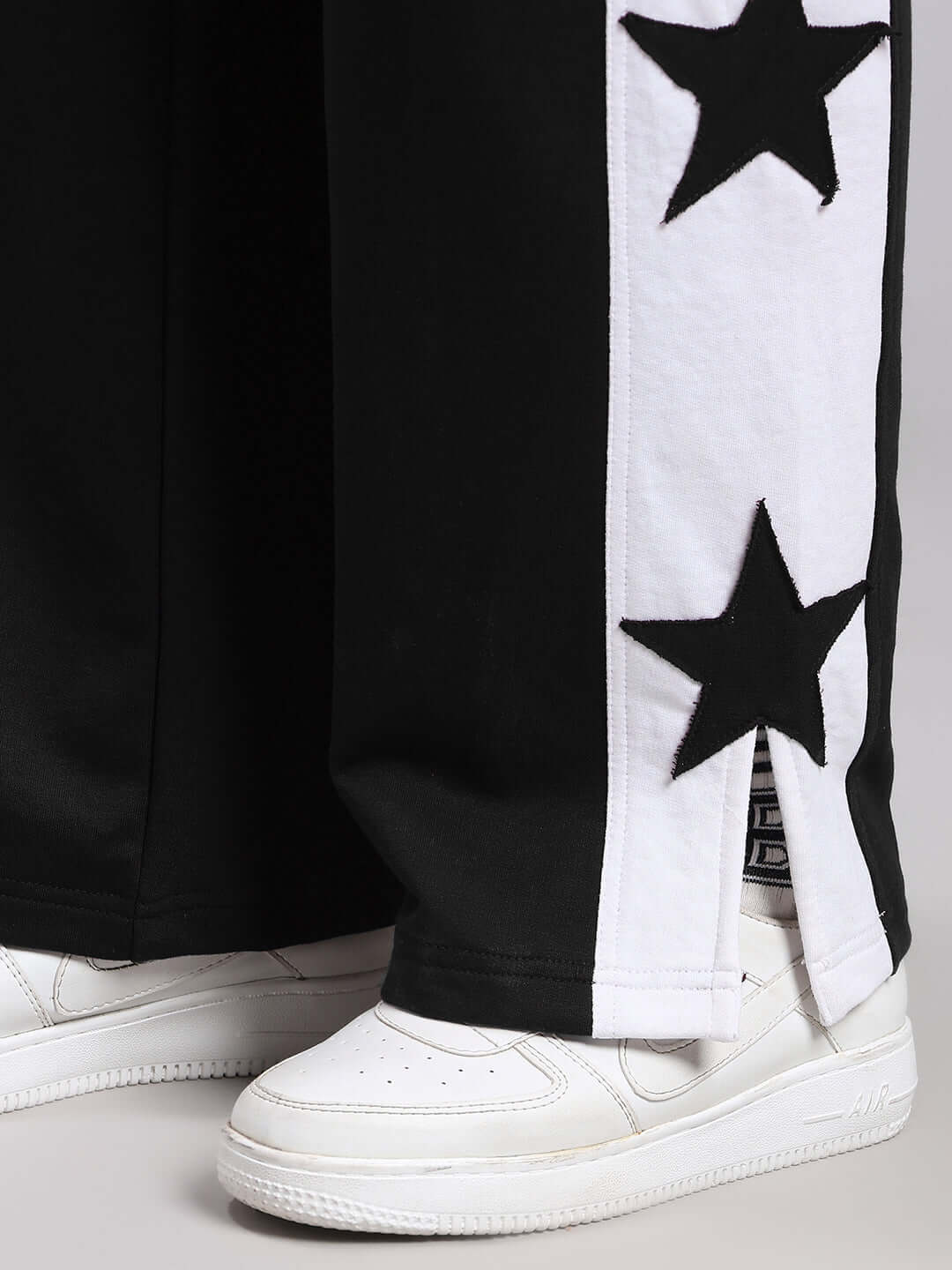Close-up of WOMENS BROX STAR RELAXED FIT JOGGERS BLACK-WHITE with star design, showcasing comfort and style.