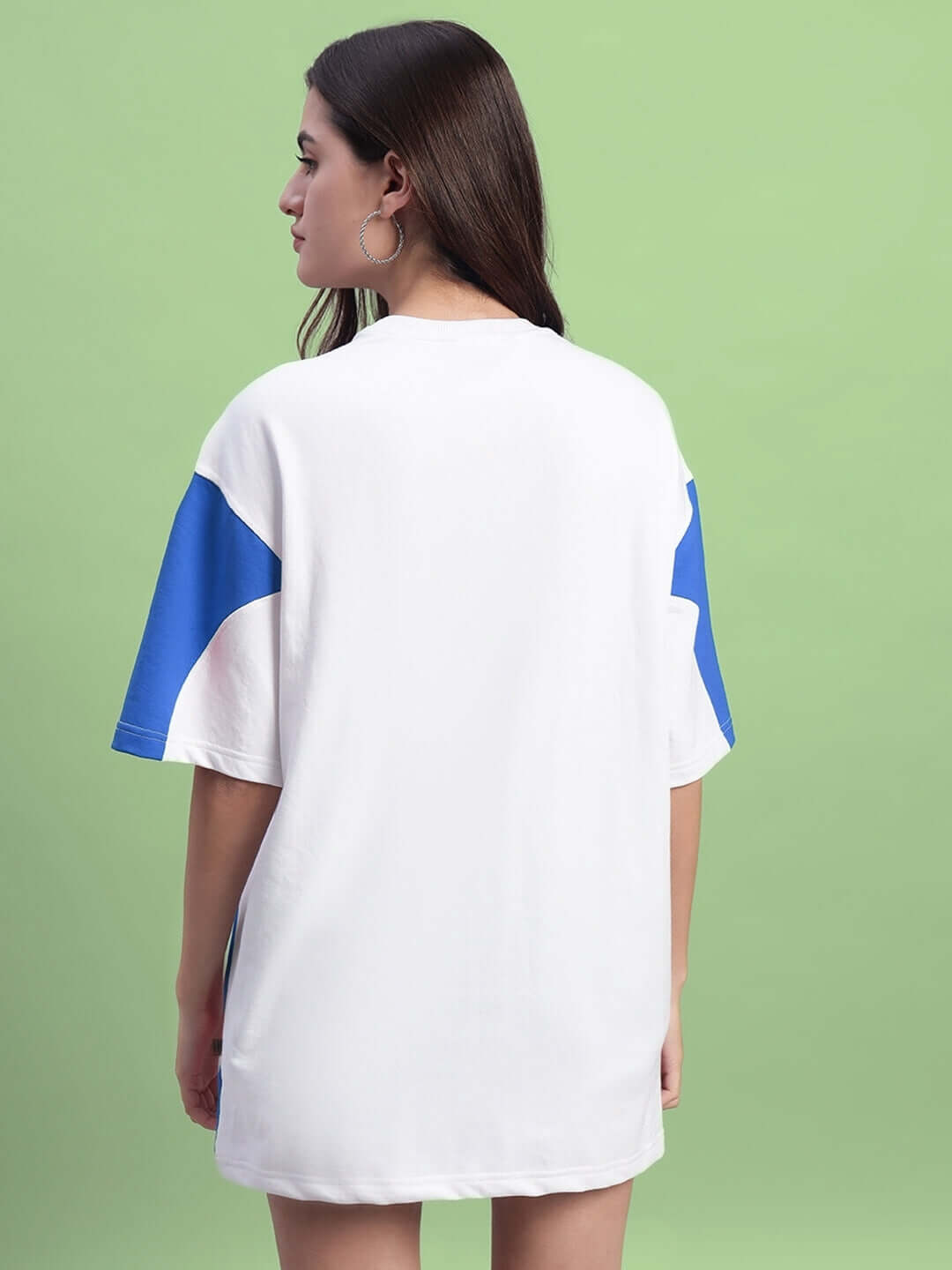 Back view of model wearing Women's Candor Oversized T-Shirt in White Blue, showcasing premium cotton fabric with blue sleeve accents.
