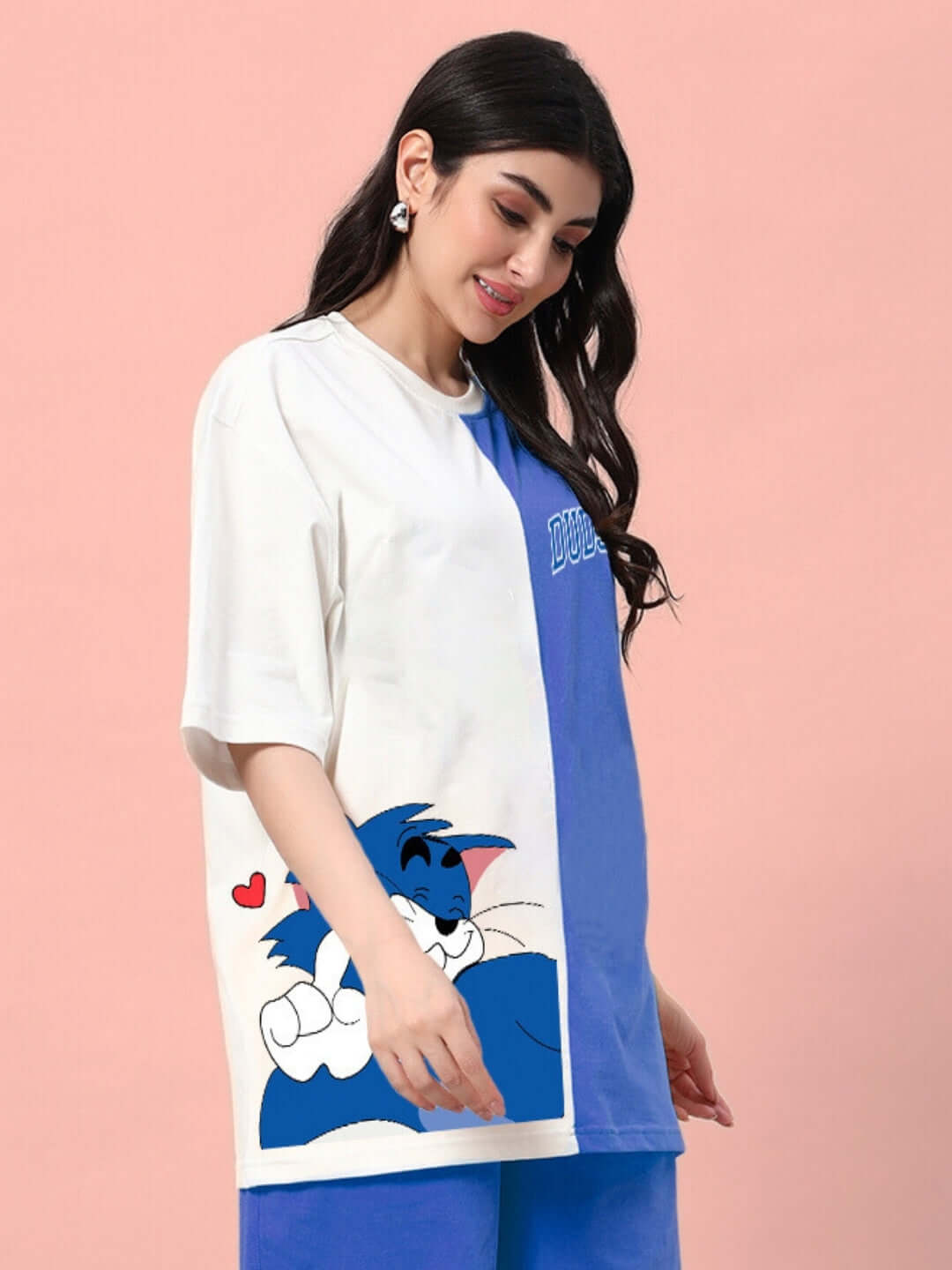 Woman wearing a Women's Caper Tom T-Shirt, blue and off-white, with a cartoon character graphic, perfect for summer style.