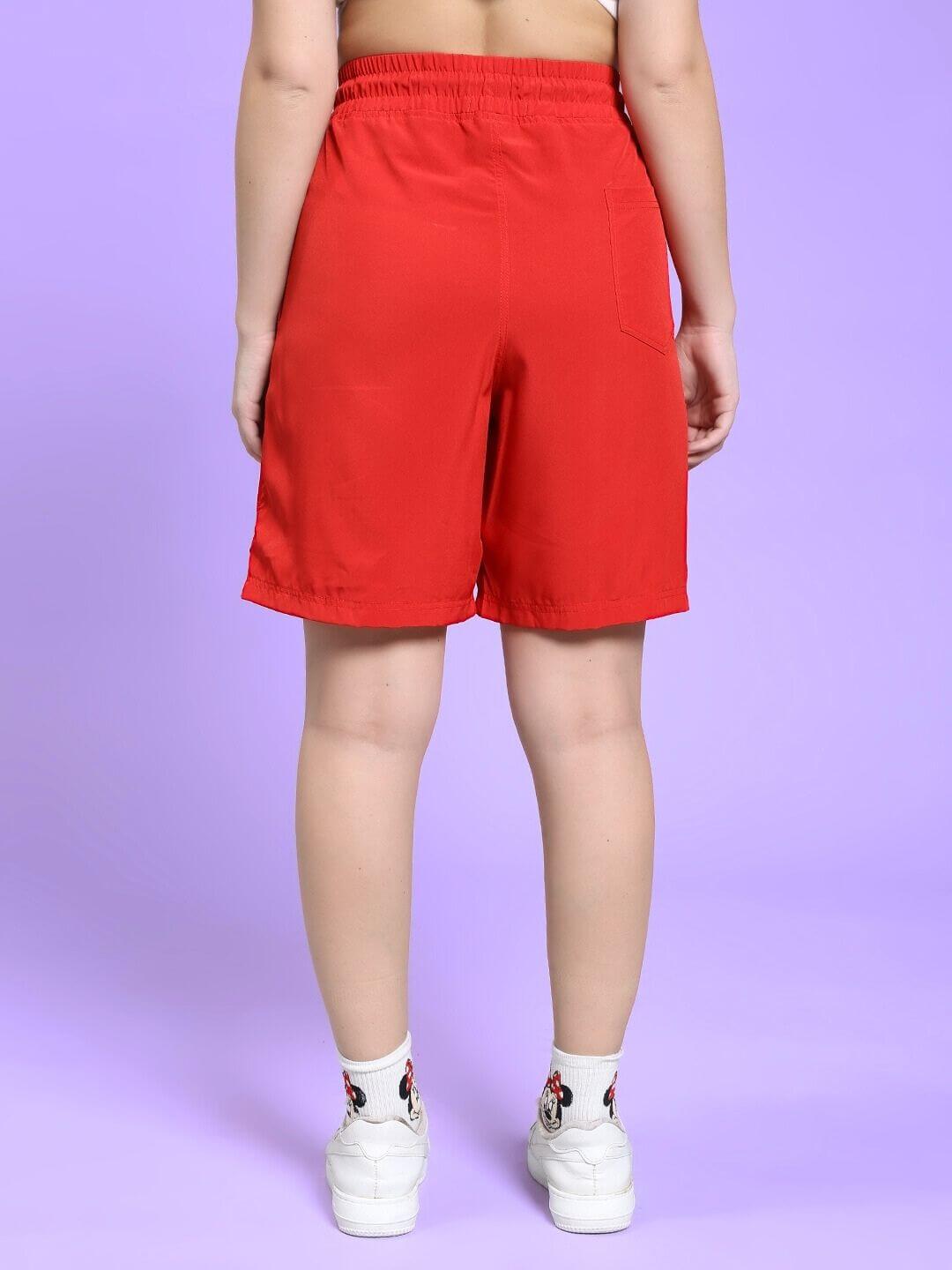 Back view of WOMEN CHAMPION ZONE FRONT PLATED SHORTS RED on model, showcasing bold color and comfortable fit.