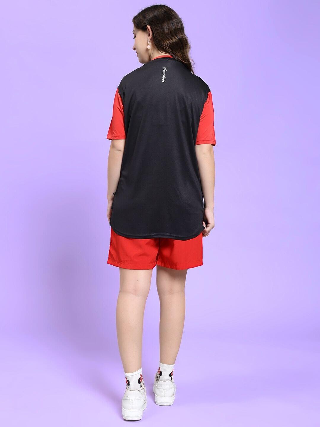 Back view of WOMEN CHAMPION ZONE REGULAR FIT CO-ORD SET BLACK RED outfit on woman, showcasing sporty and elegant design.