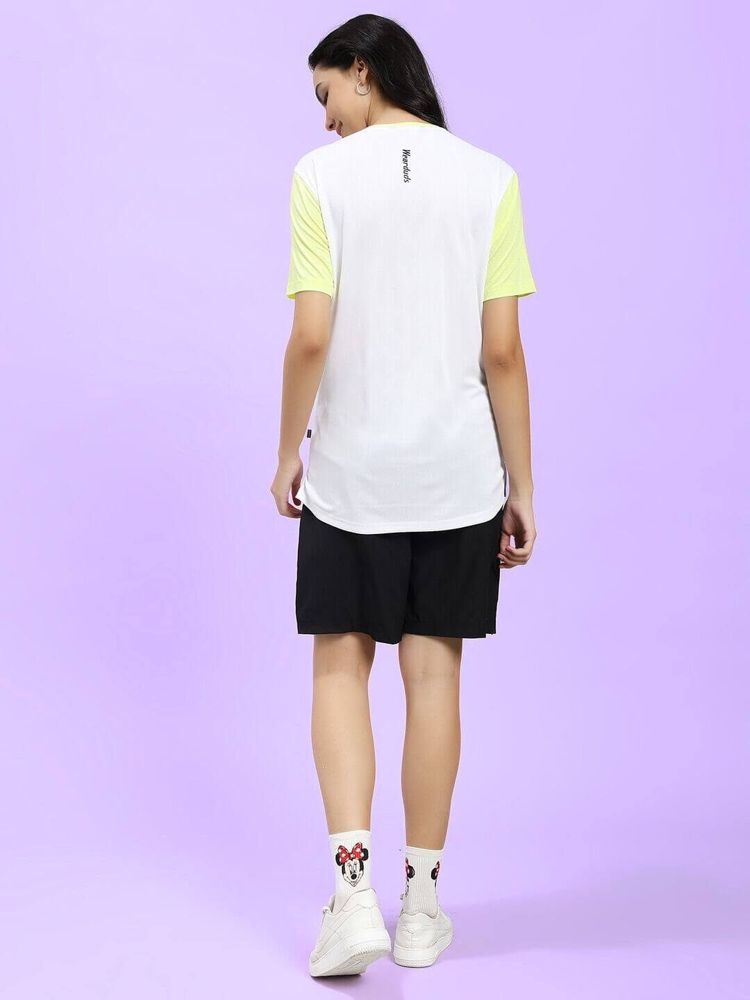 Back view of WOMEN CHAMPION ZONE REGULAR FIT CO-ORD WHITE NEON BLACK outfit with white shirt and black shorts.