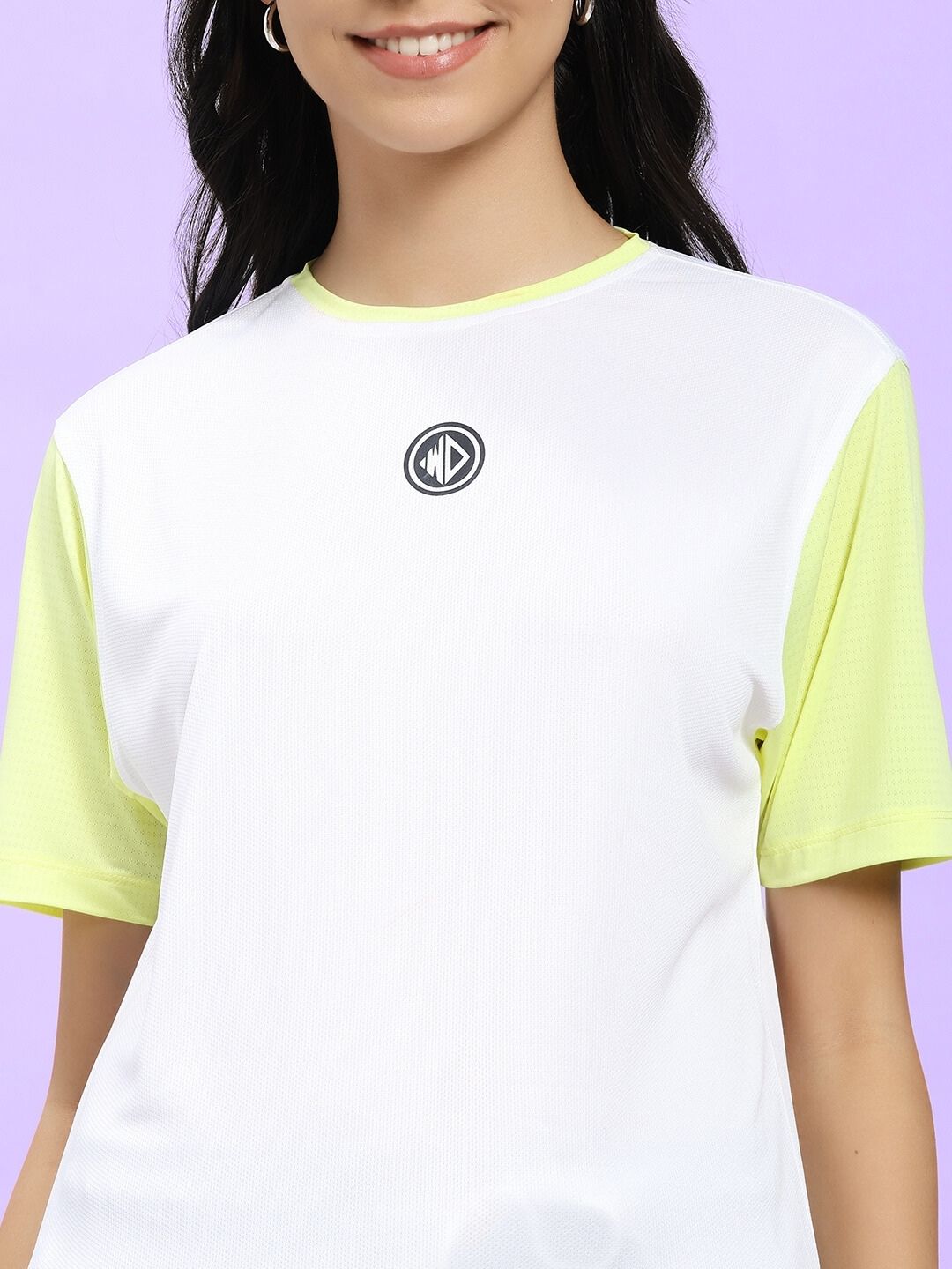 Woman wearing WOMEN CHAMPION ZONE REGULAR FIT T-SHIRT WHITE NEON-GREEN, highlighting sporty style and comfort.