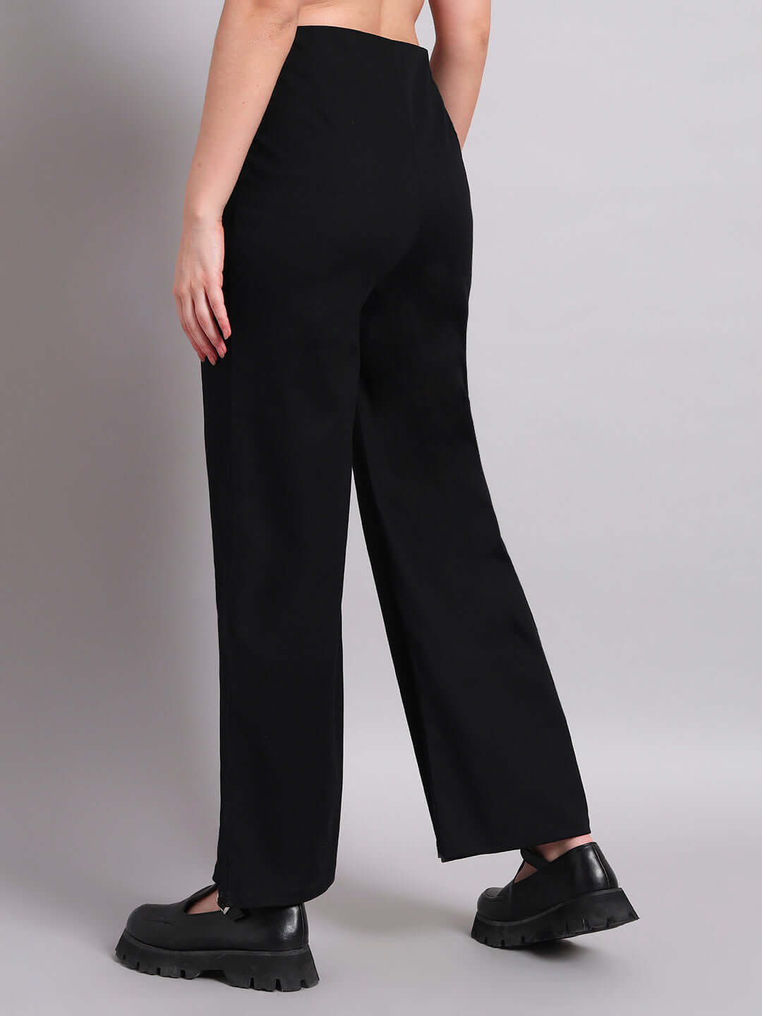 Back view of women's chic relaxed fit black jogger pants, highlighting comfort and style, tailored by DUDS.