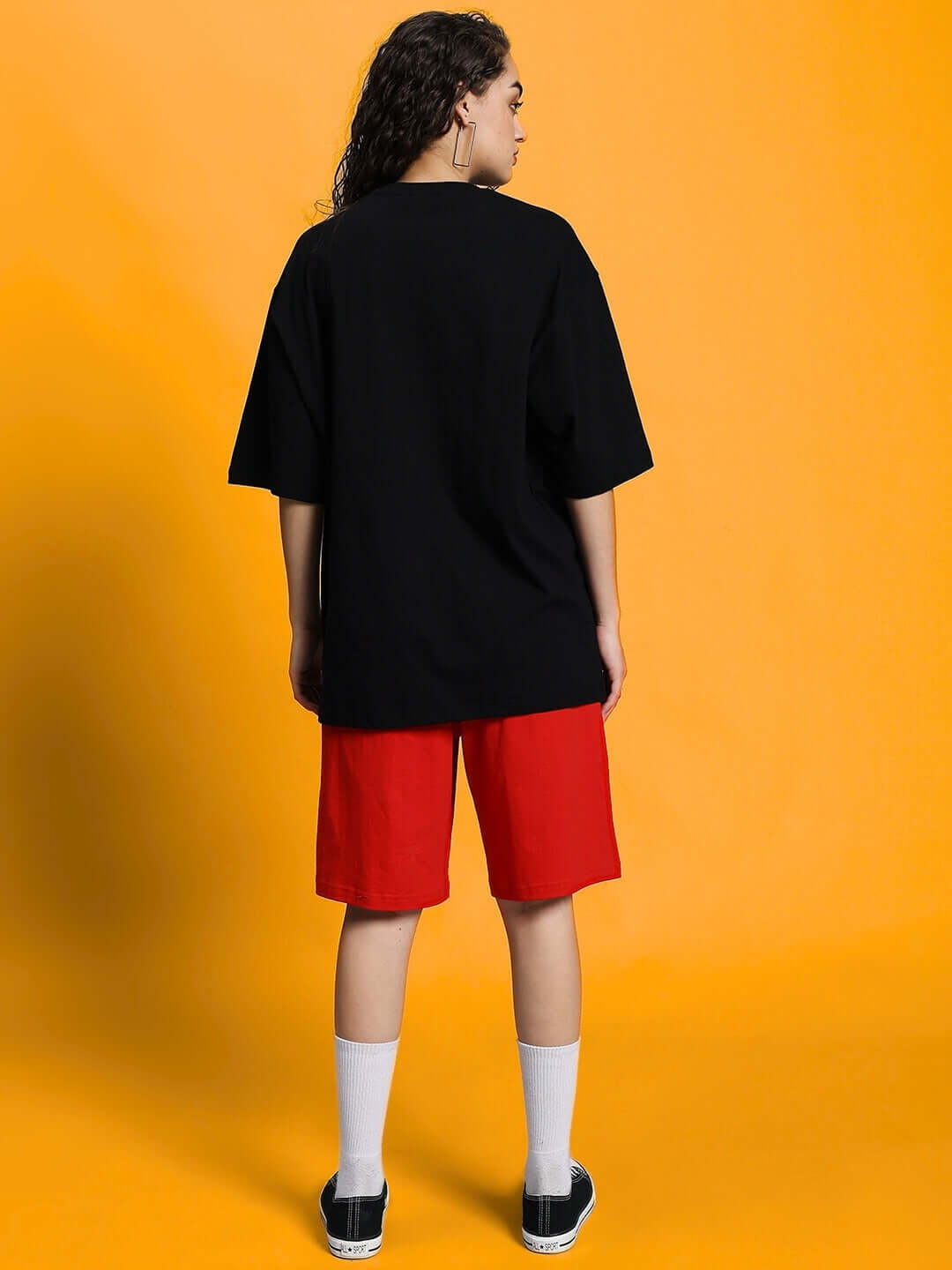 Model wearing WOMEN'S COLUMBIA 22 PRINT SUMMER CO-ORD SET BLACK RED showcasing back view.