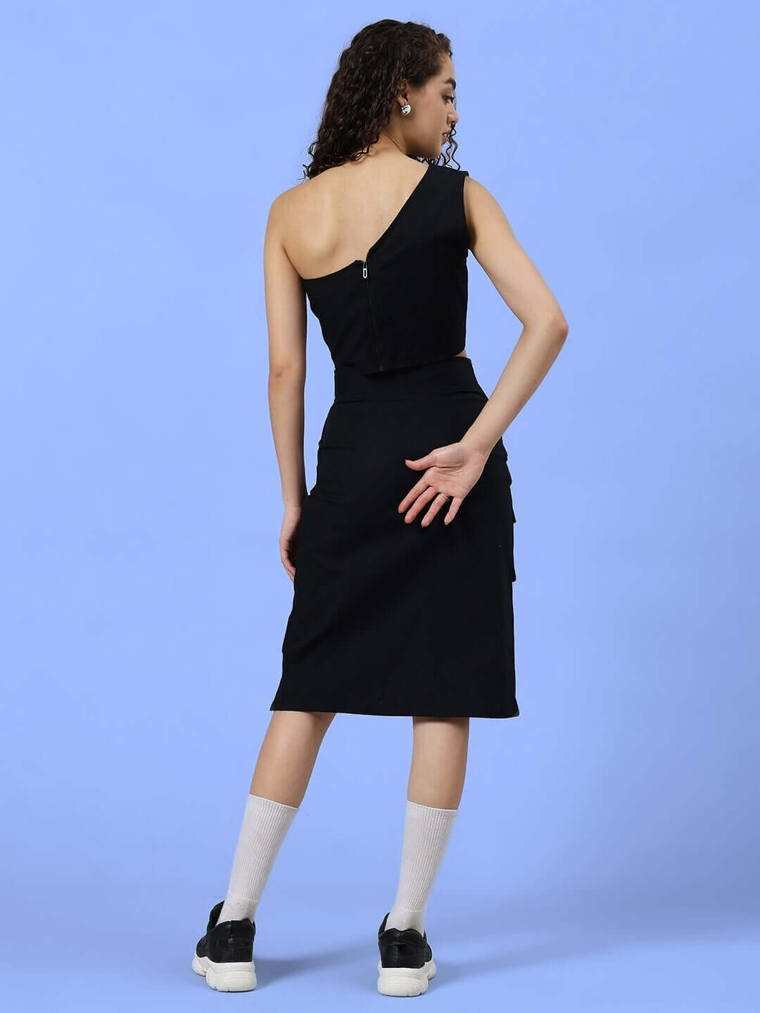 Back view of model wearing WOMEN'S COOKSEY FIT & FINE CO-ORD SET BLACK made of premium cotton twill, showcasing elegant design.