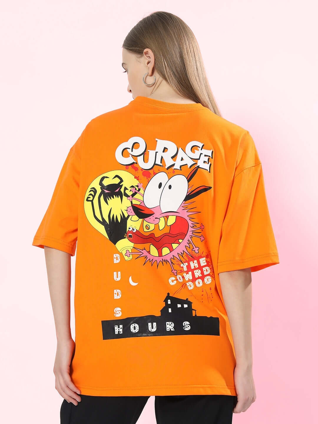 Back view of women's oversized t-shirt in orange featuring bold courage graphic design.