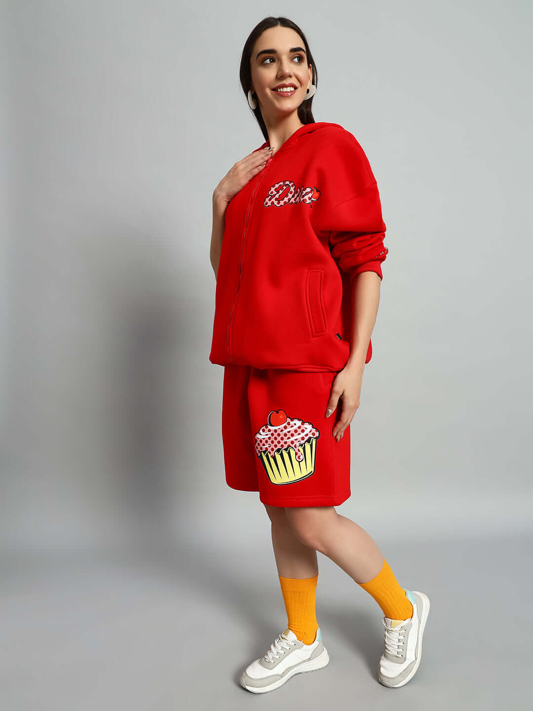 Model wearing WOMEN CUPCAKE FLEECE CO-ORD RED set with hoodie and joggers