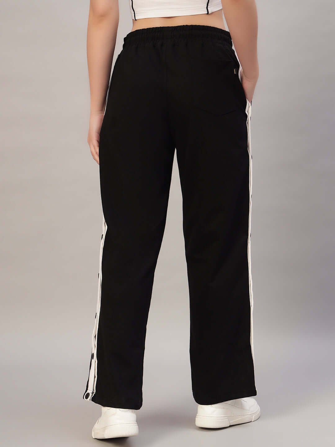 Back view of Women's Dancer Joggers in black and white, made-to-order, showcasing relaxed fit and side stripe detail for comfortable wear.