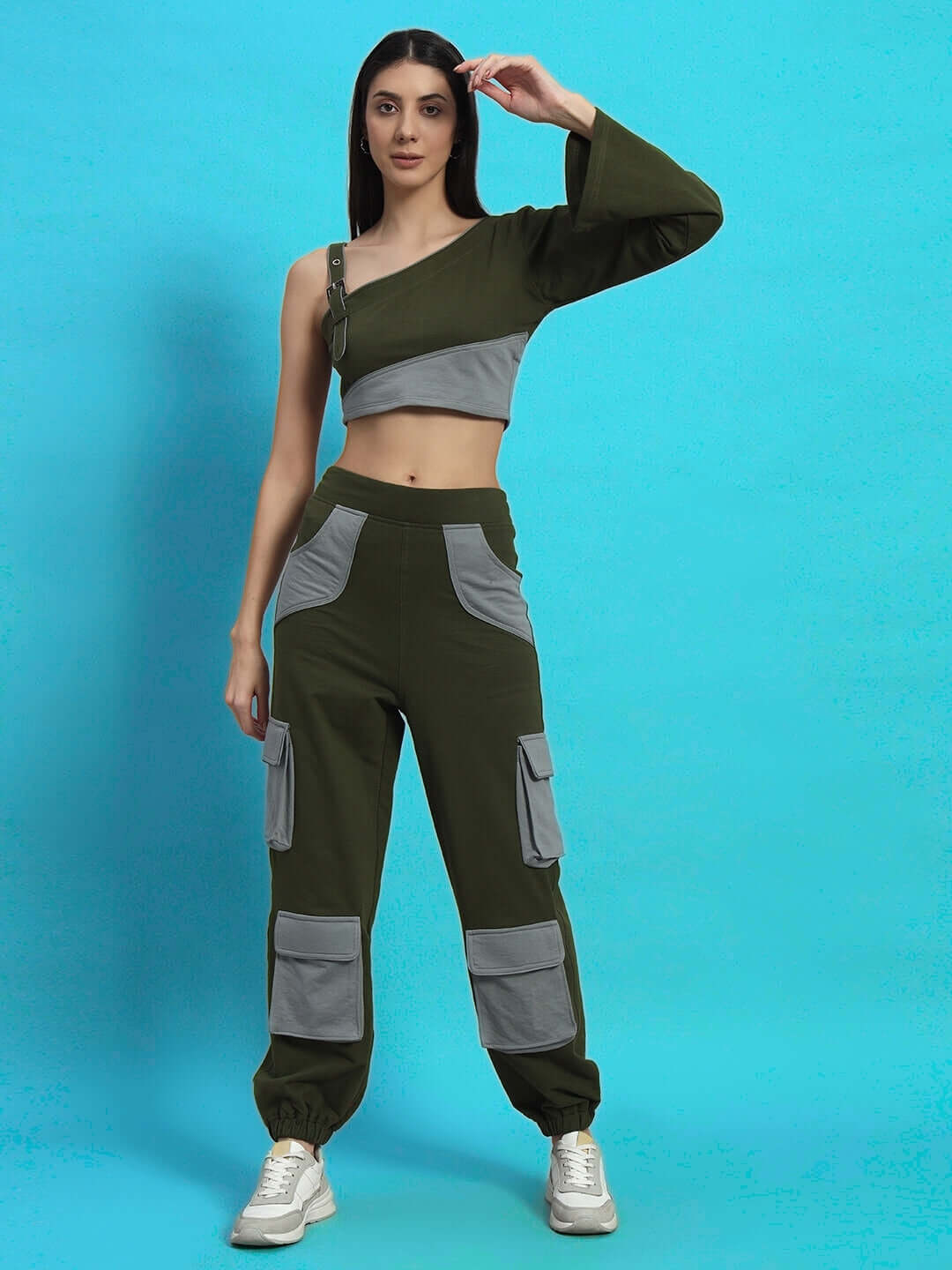 Woman modeling WOMEN'S DANIEL CO-ORD SET OLIVE GREY, stylish and comfortable outfit on a blue background.