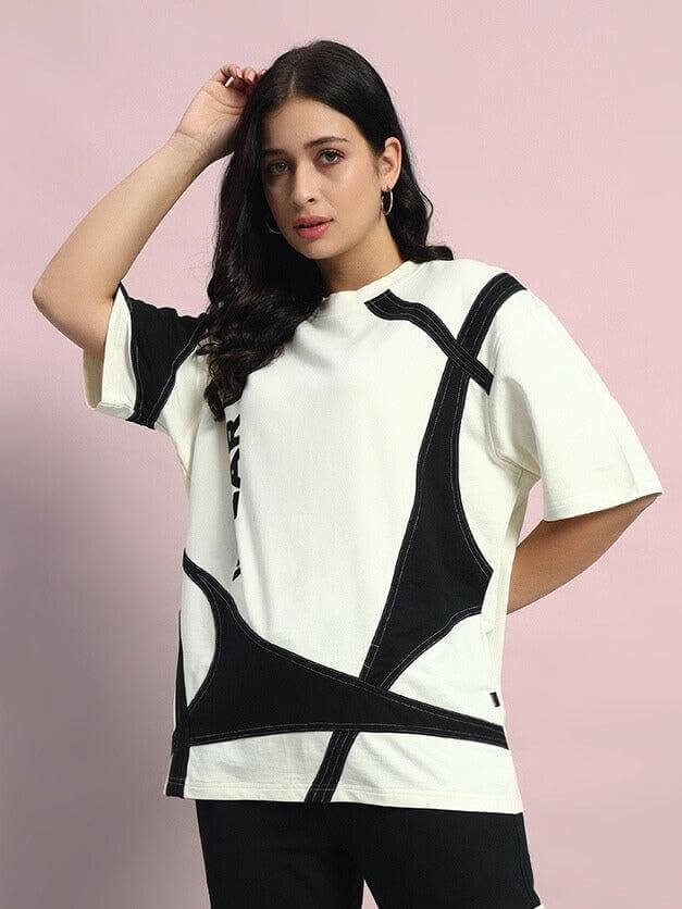Model wearing Women's David Designer Oversized T-Shirt in off-white and black, made of premium cotton French terry lycra.