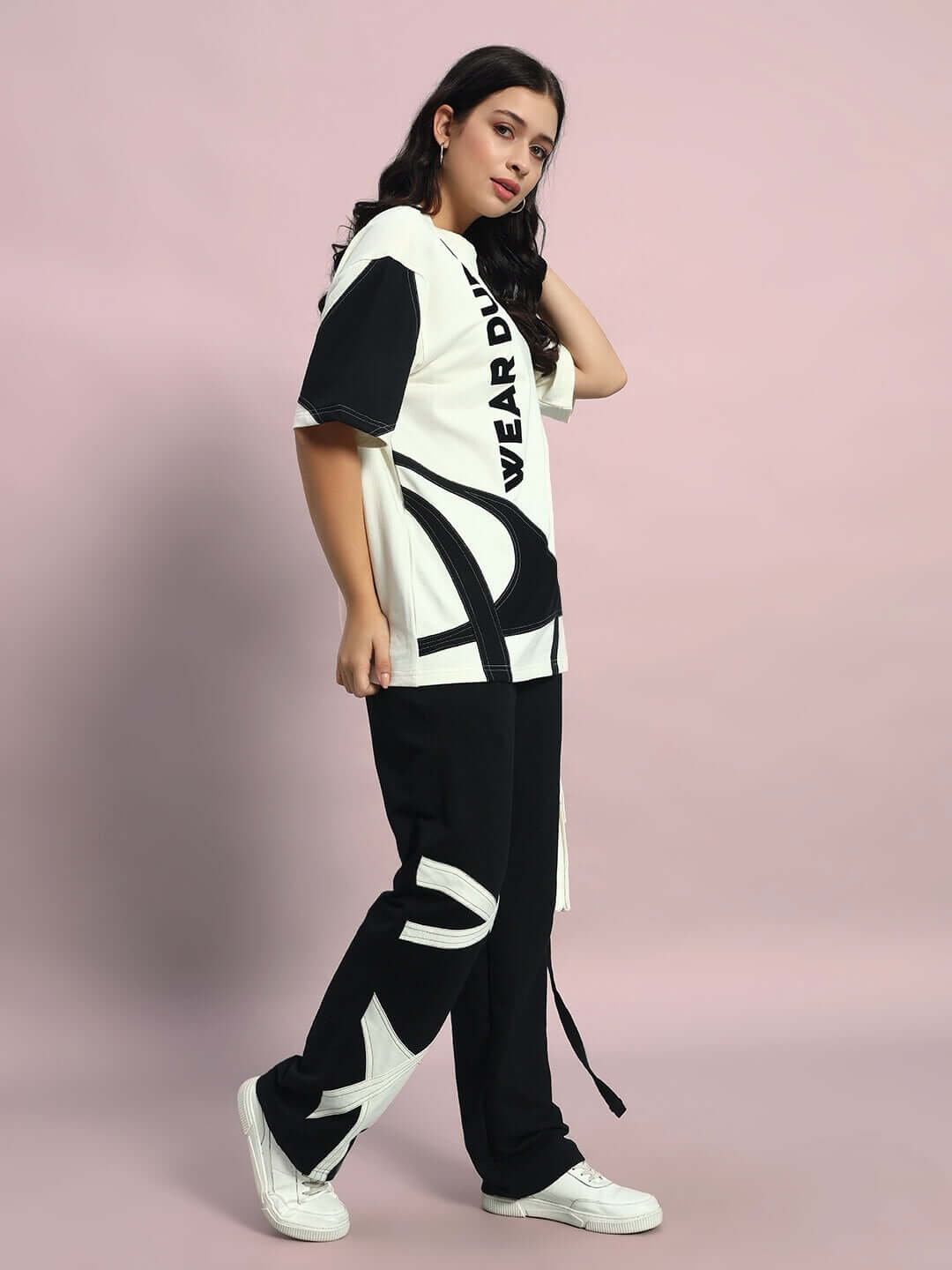Women's oversized co-ord set in off white-black, featuring relaxed fit joggers with elasticated waistband, perfect for a casual look.