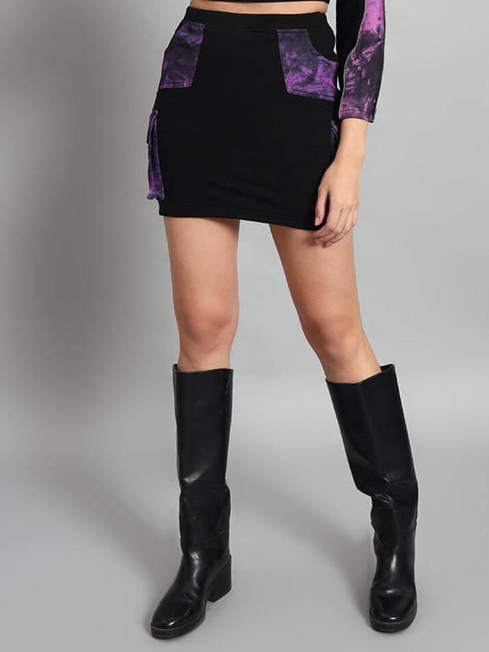 Black and purple women's Diana designer skirt with customizable fit option displayed with knee-high boots.