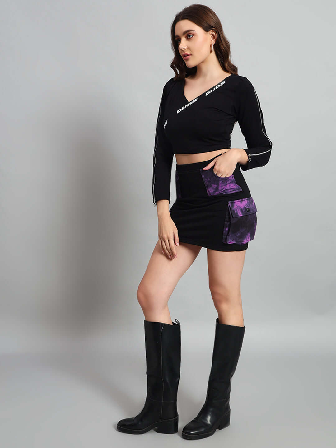 Woman wearing black-purple Diana designer skirt with custom fit option, showcasing elegance and style, perfect for fashion enthusiasts.