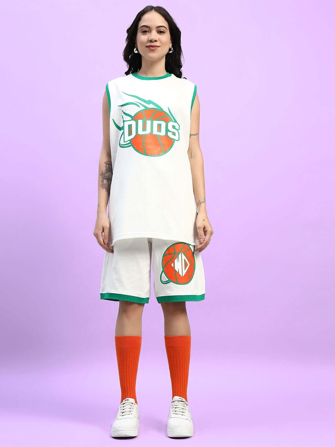 Model wearing WOMEN'S DRIBBLE CO-ORD SET OFF WHITE featuring premium heavy gauge fabric with basketball graphic design.