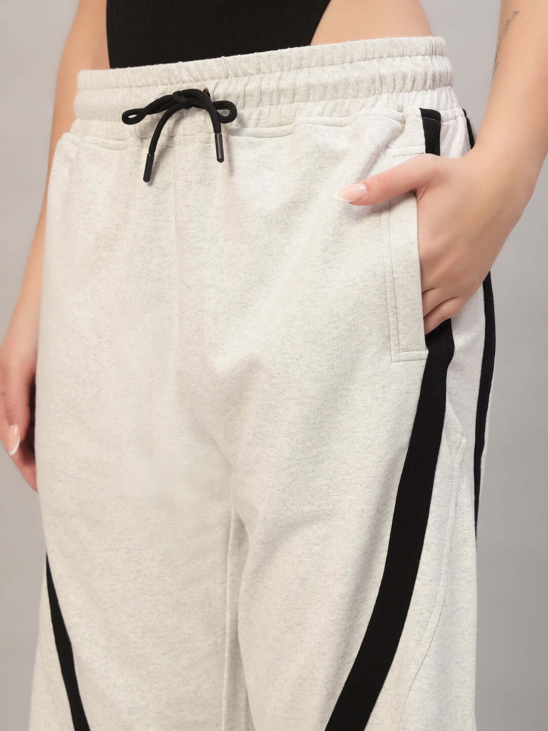 Women's DUDS Frame Joggers in Melange Grey featuring a comfortable drawstring waist and sleek black side stripe accents.