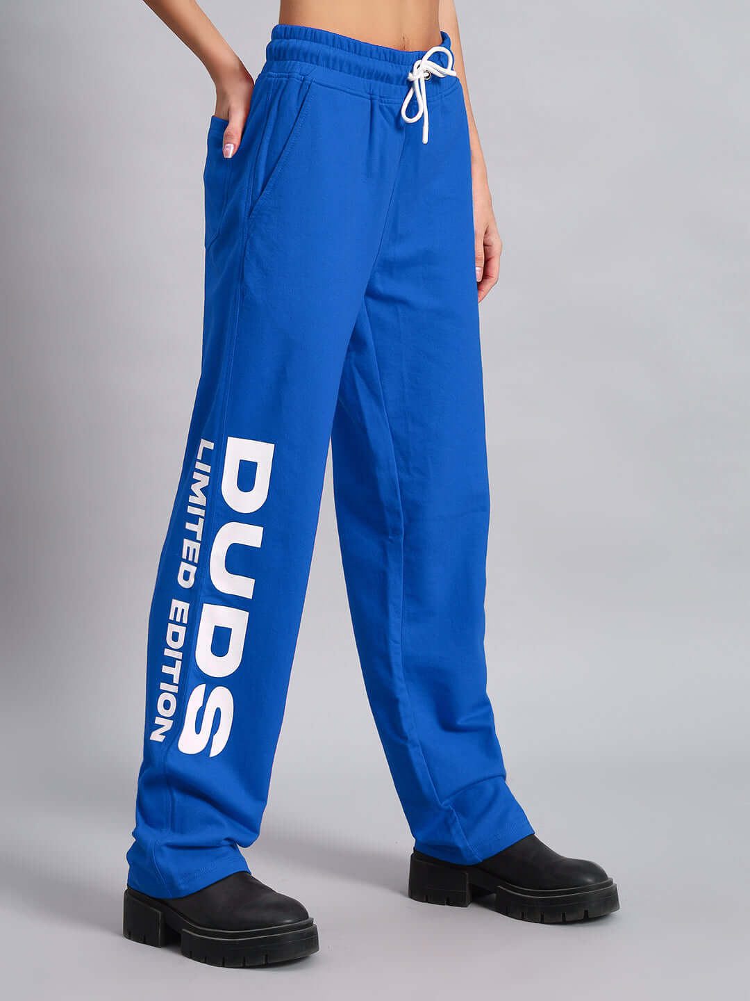 Limited edition blue women's jogger by DUDS, featuring side logo print, customizable size option for a personalized fit