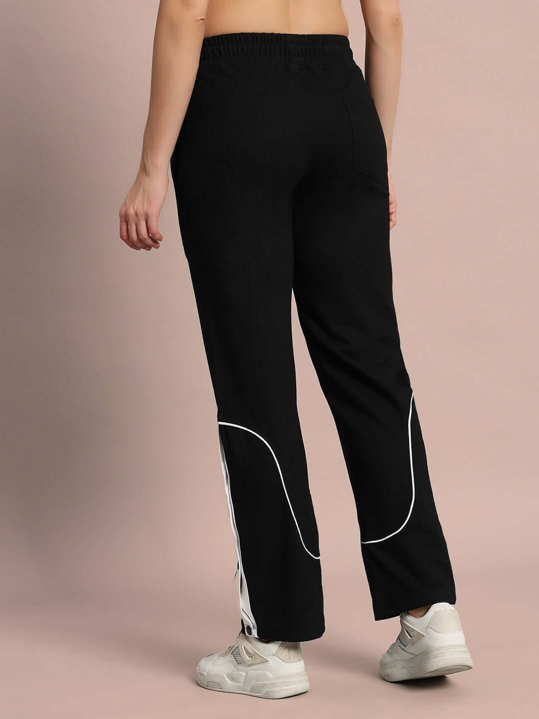 Back view of black women's Eddie contrast joggers with white accents, customizable fit from DUDS, comfortable for casual wear.