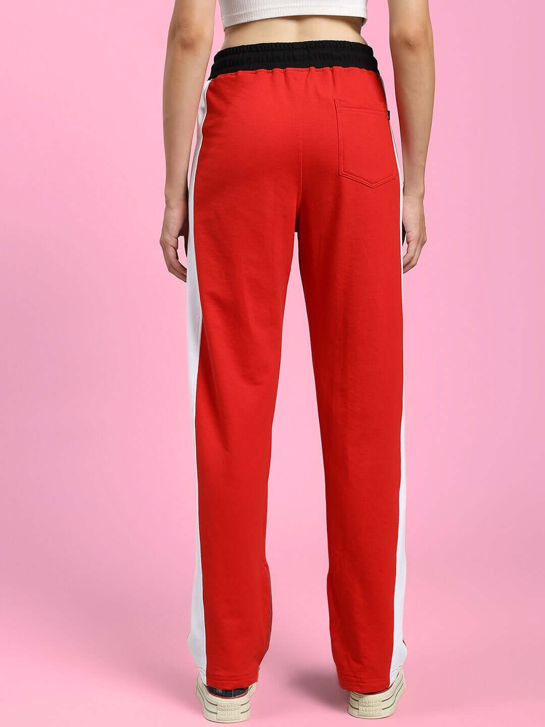Back view of WOMENS ELEGANT RELAXED-FIT JOGGERS RED with white stripe detail and black waistband.