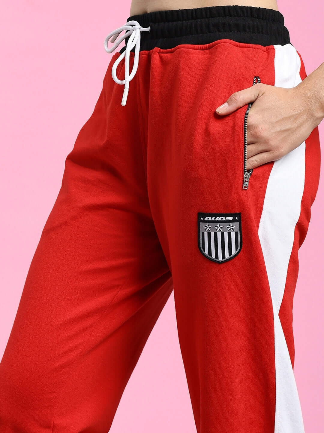Close-up of WOMENS ELEGANT RELAXED-FIT JOGGERS RED with side pocket and drawstring waist, showcasing the vibrant color and sporty design.