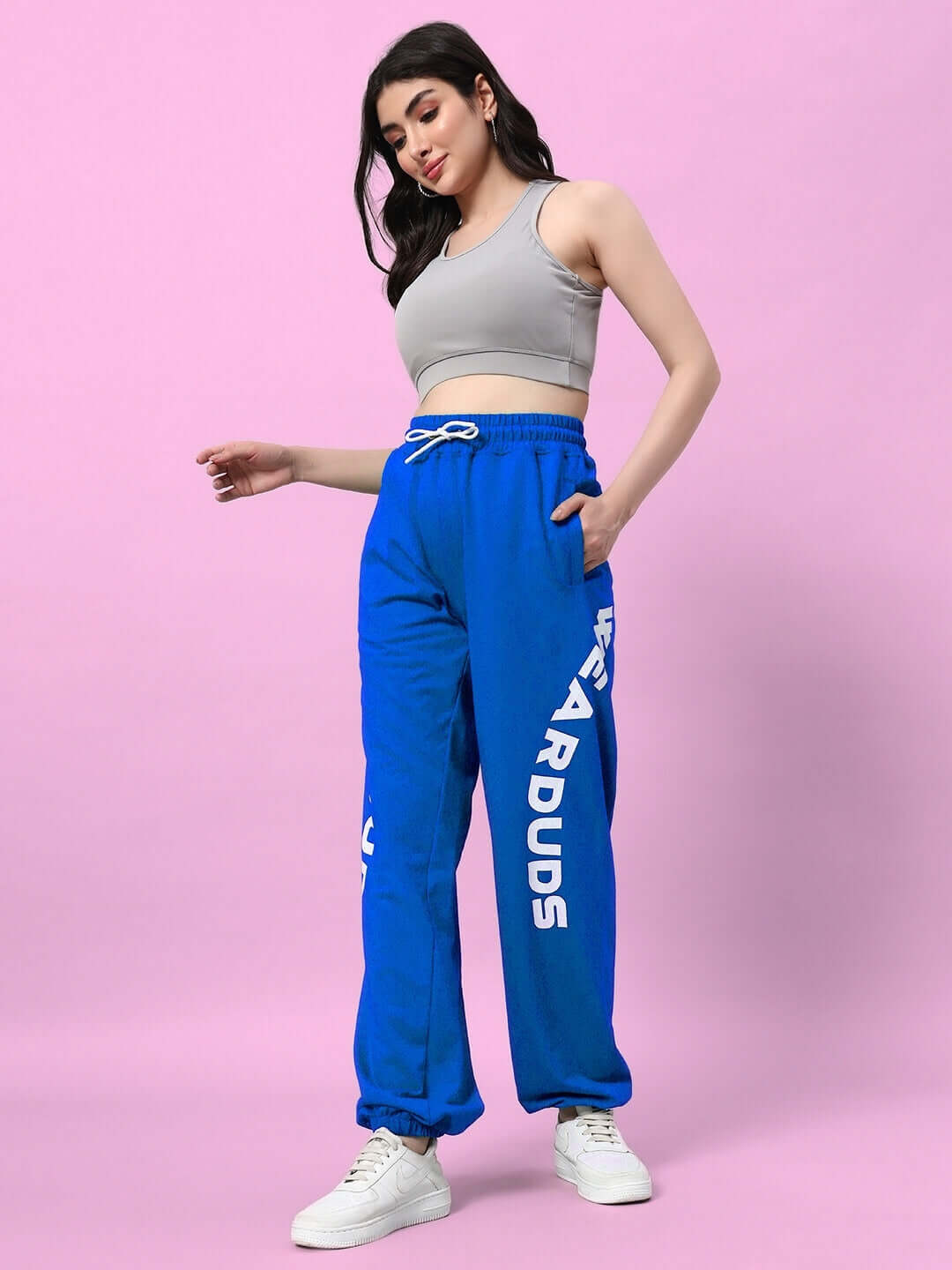 Model wearing Women's Ellen Relaxed Fit Jogger in blue by DUDS, showcasing custom fit option and relaxed style