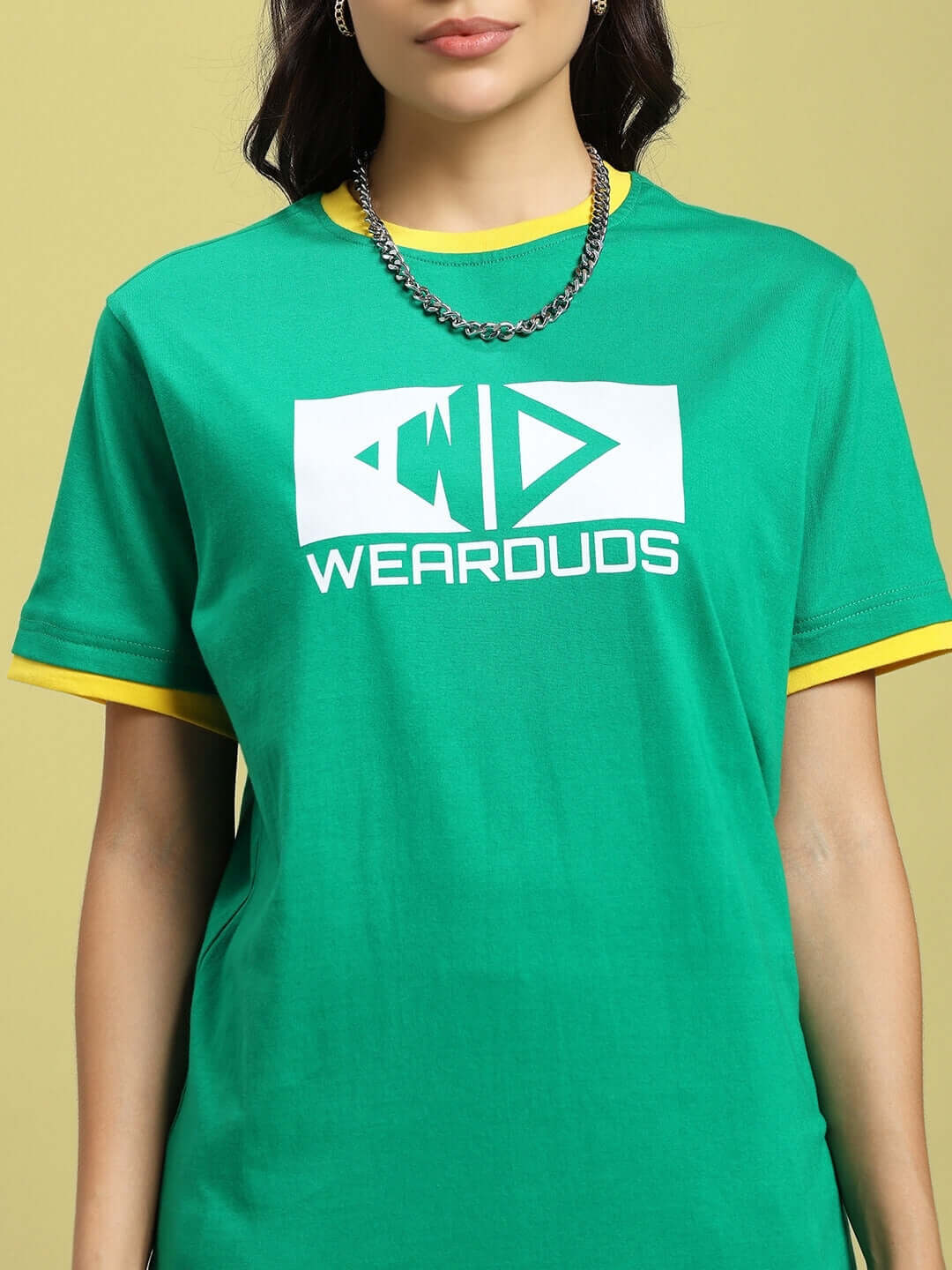 Green women's regular fit T-shirt with yellow accents and text logo, showcasing stylish casual wear fashion.