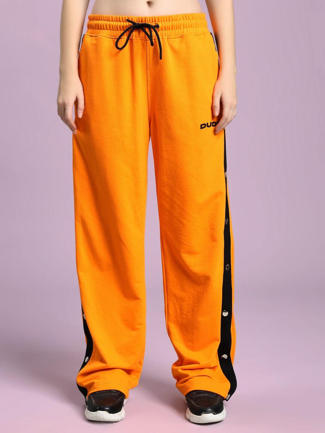 WOMEN'S EMBER BOLT SIDE JOGGER ORANGE with stripe detailing, perfect for vibrant casual wear.