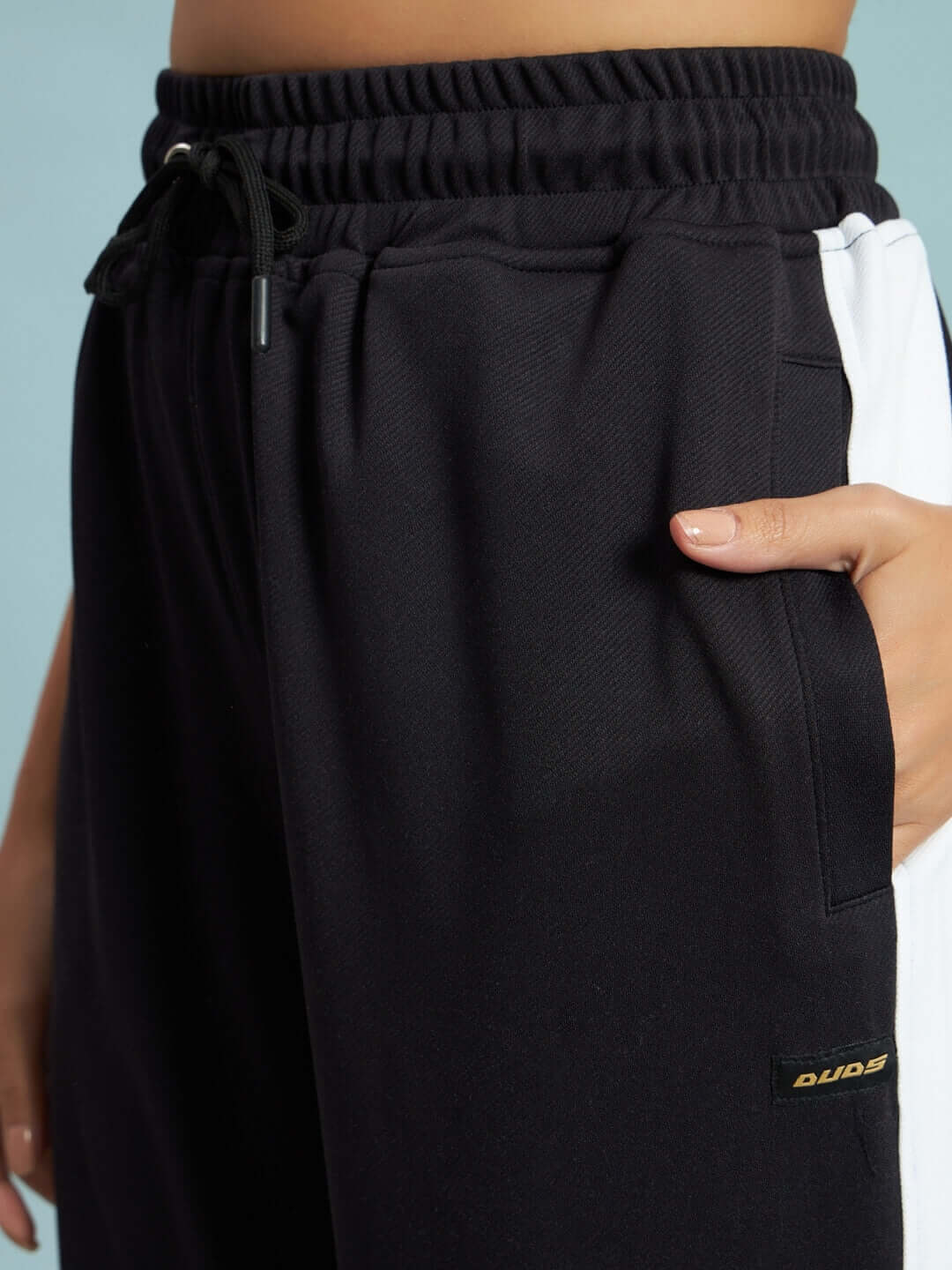 Stylish black and white women's Euphoria joggers by DUDS, featuring customizable fit and premium tailoring.