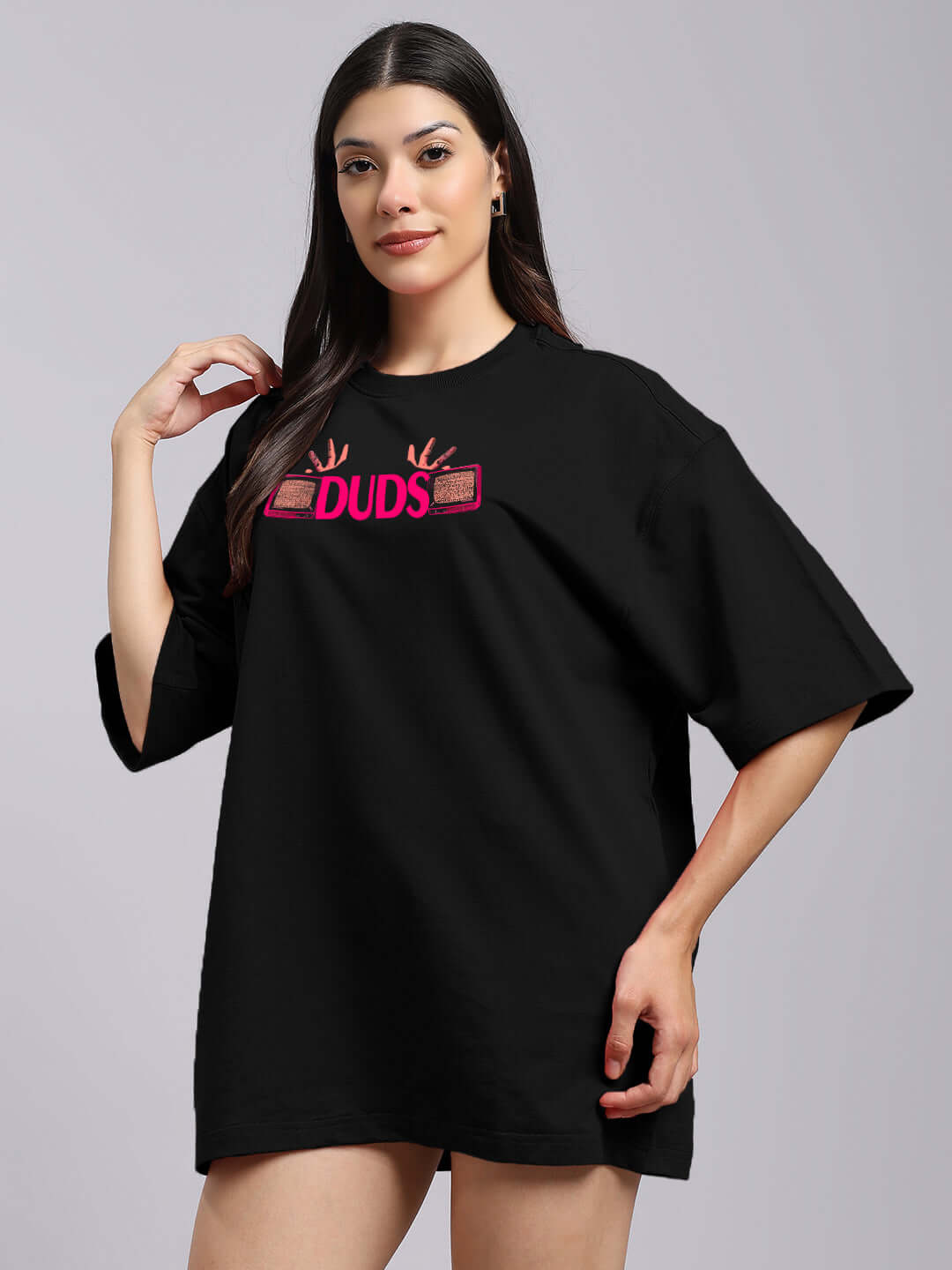 Model wearing a women's Eyeconic oversized black printed t-shirt made of premium cotton French terry blend.