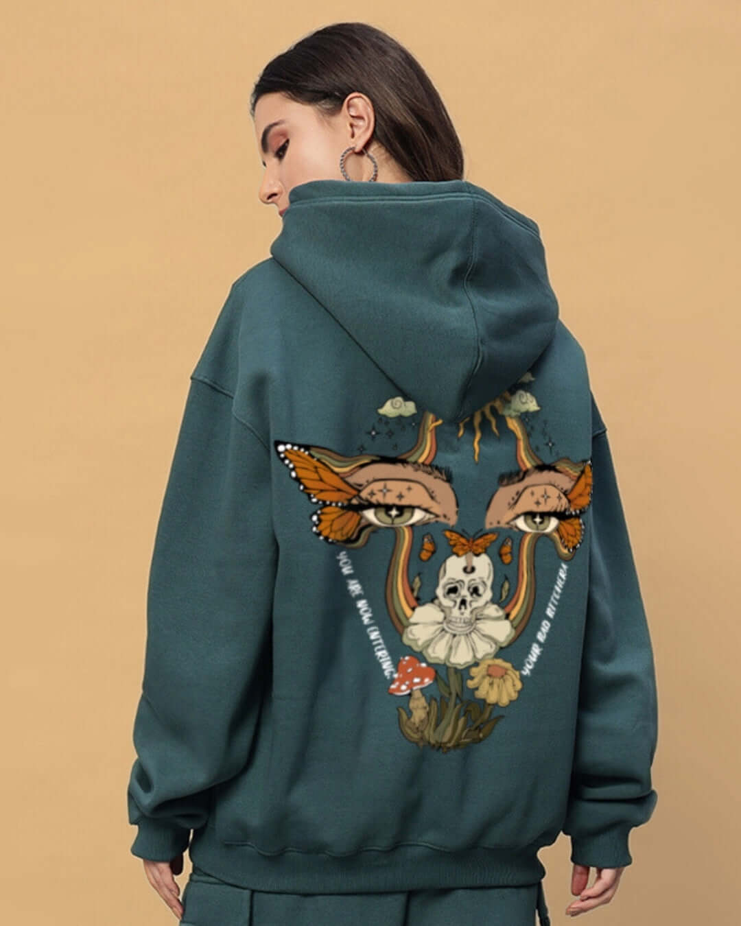 Woman wearing WOMEN'S EYES ON RISE FLEECE CO-ORD TEAL GREEN with artistic back print