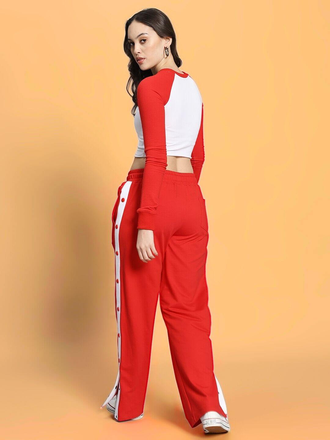 Woman wearing WOMEN'S EZEL CO-ORD SET RED-WHITE for sporty, bold style