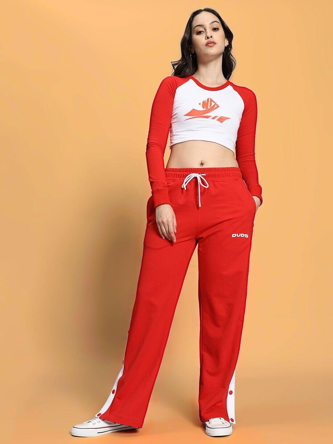 Woman wearing WOMEN'S EZEL CO-ORD SET RED-WHITE, featuring sporty and street-chic style with bold red and white colors for a confident look.