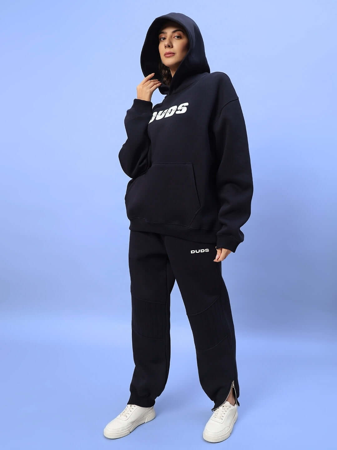 Model wearing women's fight night fleece jogger in navy blue, showcasing cozy and stylish fashion for active wear.
