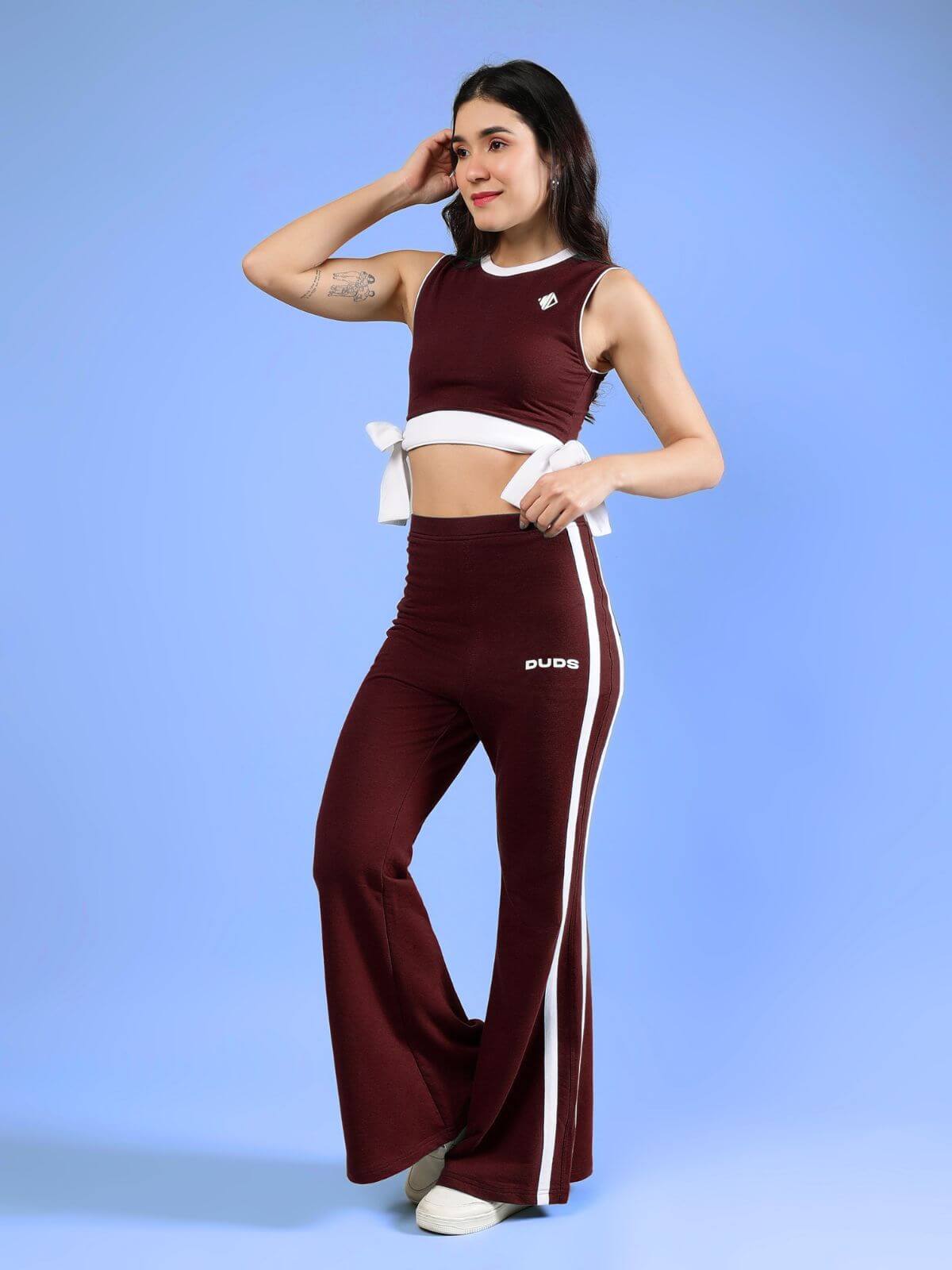 WOMENS FITTONIA COOL CO-ORD SET MAROON showcasing a stylish coordinated maroon outfit with sporty details.