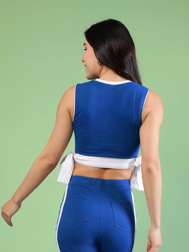 WOMENS FITTONIA COOL CROP TOP BLUE showcasing the vibrant back view with a stylish twist design.