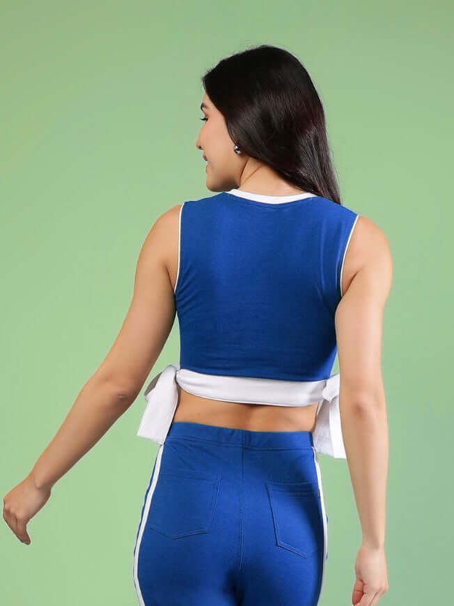 WOMENS FITTONIA COOL CROP TOP BLUE showcasing the vibrant back view with a stylish twist design.