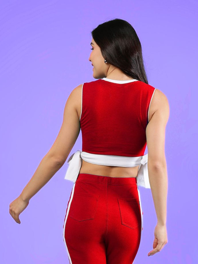 WOMENS FITTONIA COOL CROP TOP RED worn by a model, showcasing a stylish back view with vibrant red color.