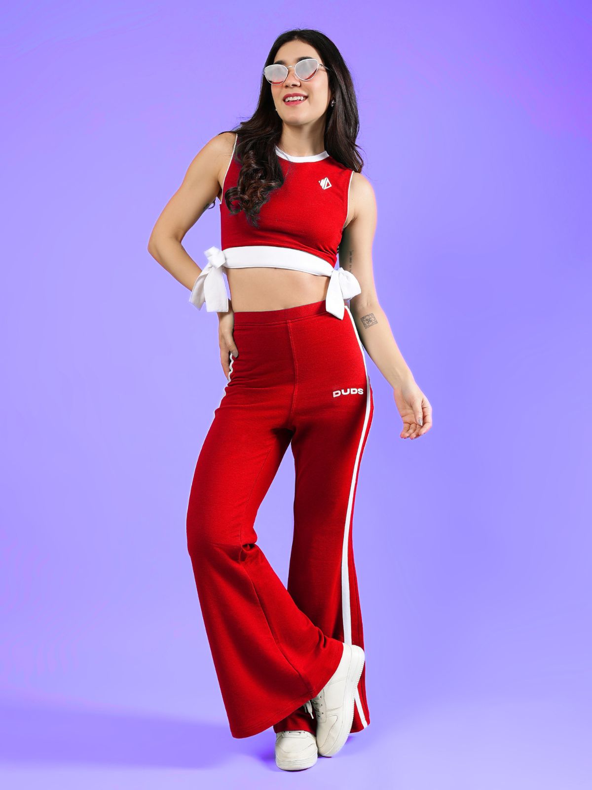 WOMENS FITTONIA COOL CROP TOP RED paired with stylish red flared pants, perfect for casual outings and workouts.