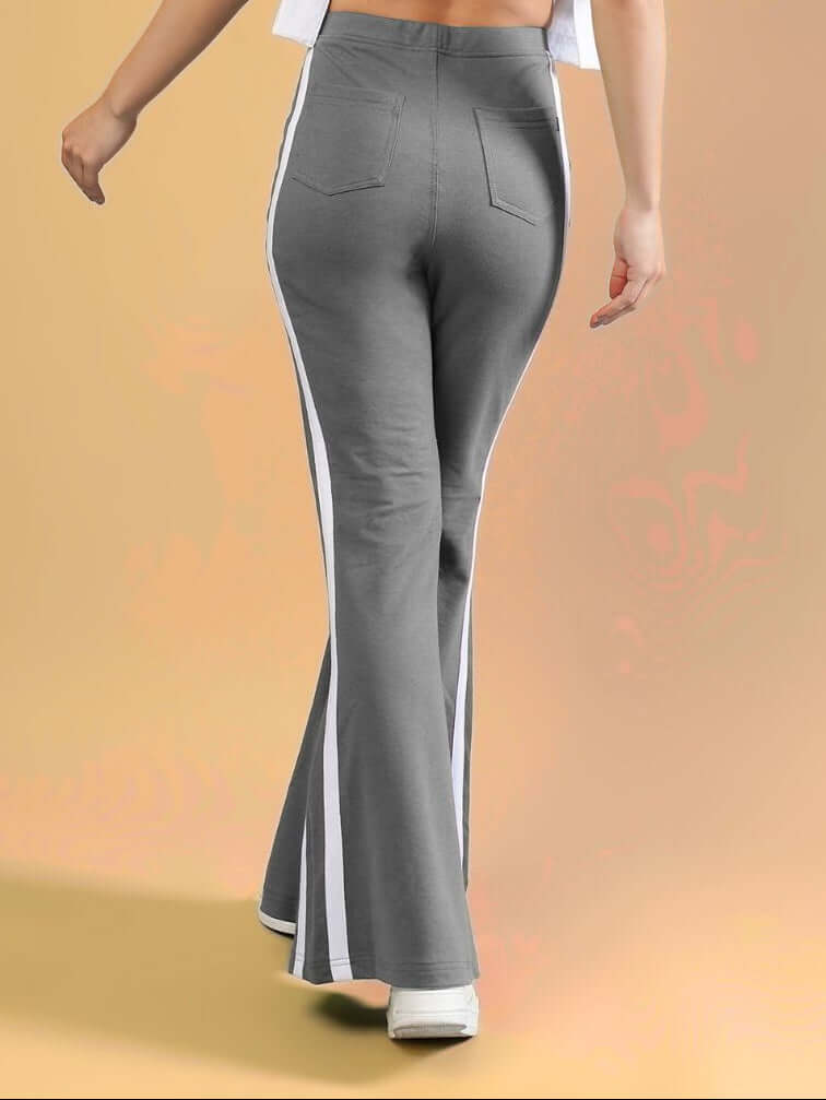 WOMENS FITTONIA COOL WIDE FLARE JOGGERS GERY in grey with white stripes, showcasing a stylish and relaxed fit.