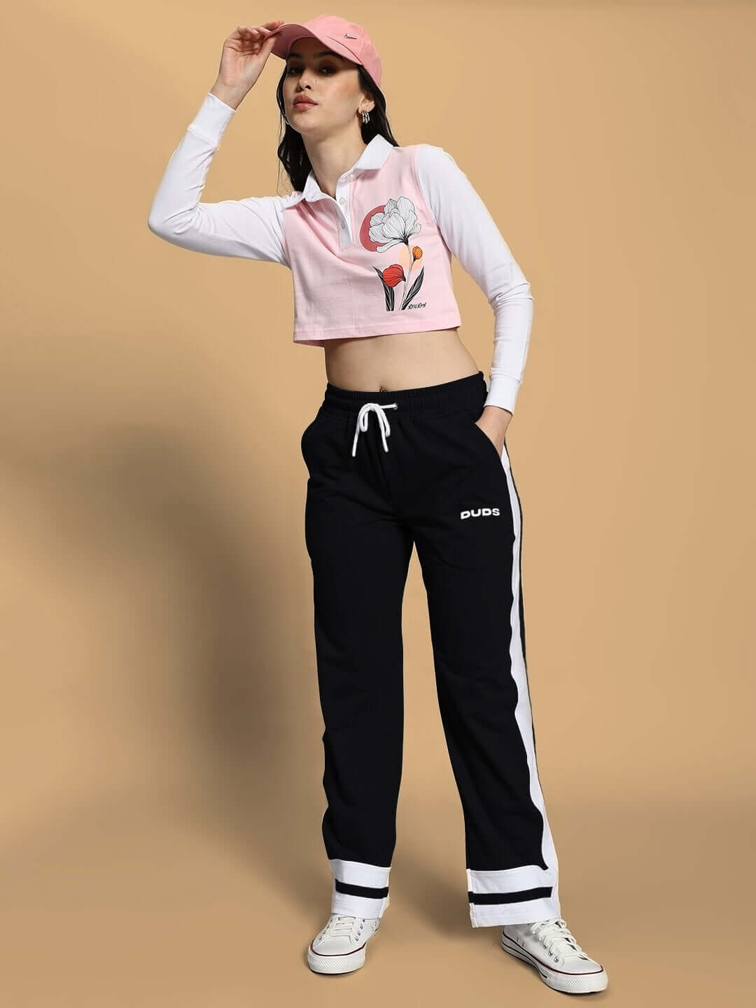 Model wearing WOMEN'S FLORA CO-ORD SET PINK BLACK by WEAR DUDS, combining vibrant colors with comfortable streetwear style.