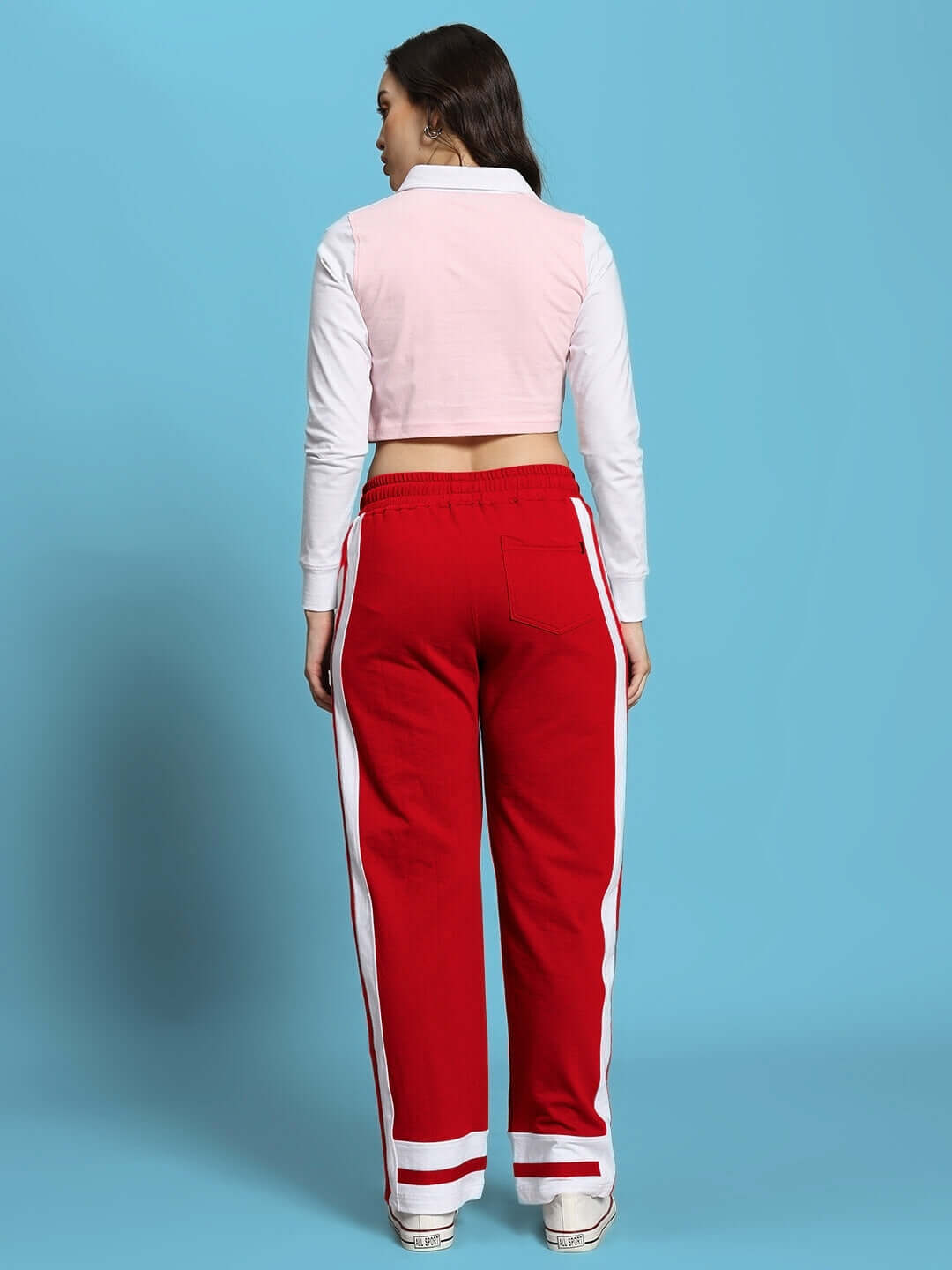 Back view of WOMEN'S FLORA CO-ORD SET PINK RED, featuring red pants and a pink top, showcasing vibrant streetwear style.