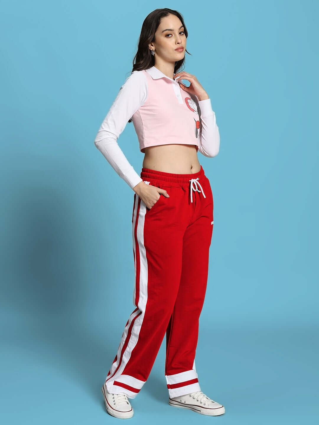 Model wearing the WOMEN'S FLORA CO-ORD SET PINK RED by WEAR DUDS, showcasing playful elegance and vibrant streetwear style.