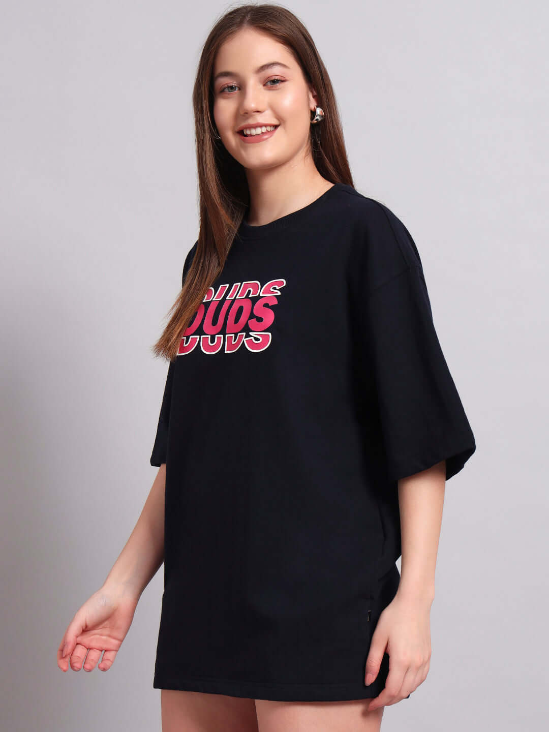Model wearing Women's Flores Creative Print Oversized T-Shirt in navy blue with premium cotton fabric, comfortable loose fit.