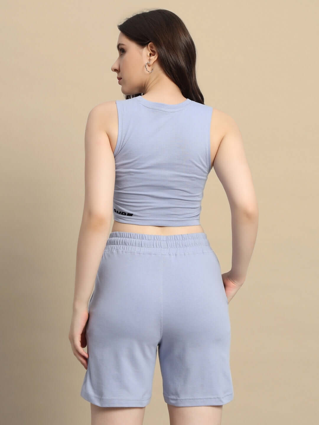 Back view of a woman wearing a steel blue floret co-ord set made of premium cotton French terry lycra, ideal for casual wear.