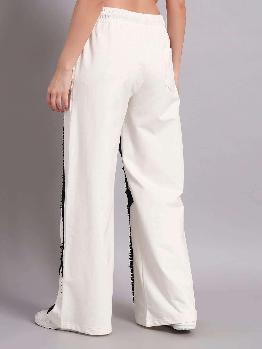 Back view of women's off white-black frayed textured stripes co-ord set joggers with elasticated waistband, 97% cotton blend.