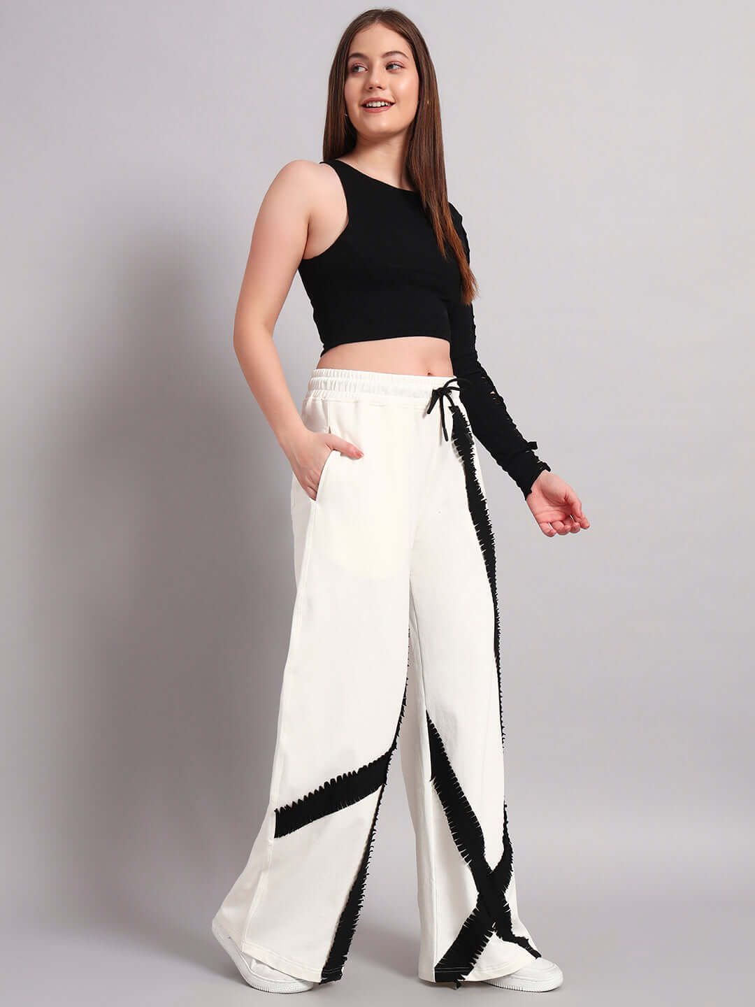 Women's frayed textured stripes co-ord set in off white-black, featuring relaxed joggers with elasticated waistband, shown on a model.